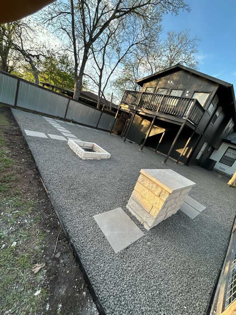 Gravel outdoor living area with seating - LongHorn Landscape & Irrigation