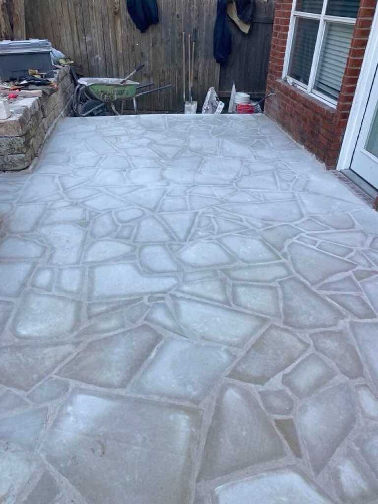 Tiered limestone retaining wall with turf and stone steps - LongHorn Landscape Hill Country project